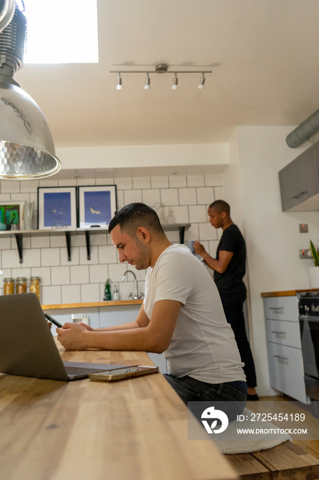 UK, London, Gay couple in kitchen