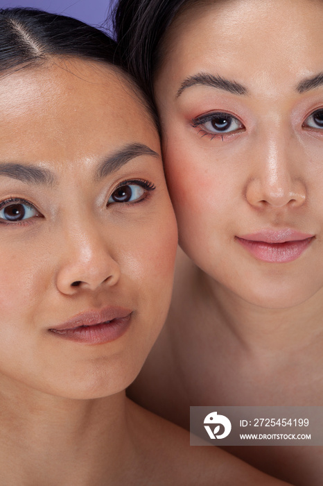 Close-up�of two women cheek to cheek