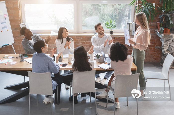 Female manager making marketing report at business meeting