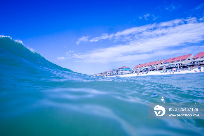 blue crystal water waves crashing on beach