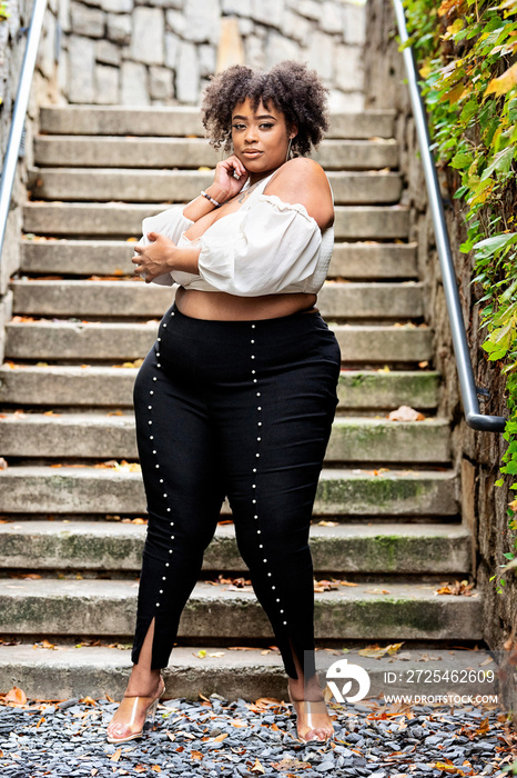 Plus size Black woman showing off fashion outside