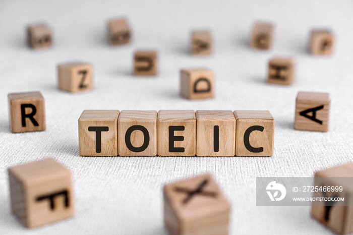 TOEIC - words from wooden blocks with letters, Test of English for International Communication TOEIC