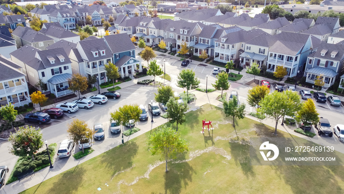 Top view new townhome cottage style houses near community park with public art installation suburbs 