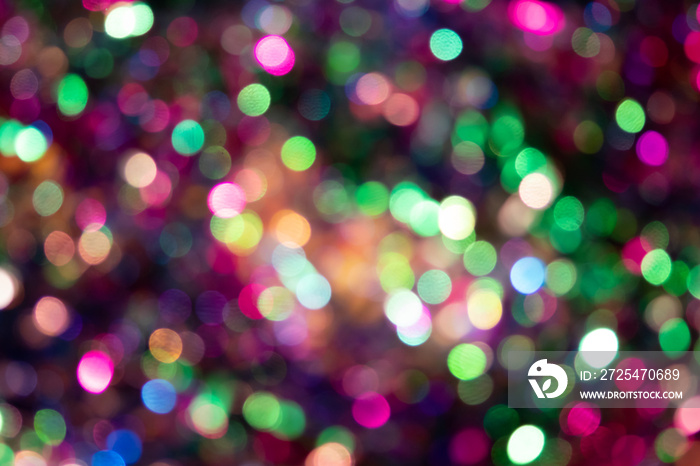 Funkelnde Lichter als buntes Bokeh ist der perfekte Hintergrund für Weihnachtsfeier, Silvesterparty 