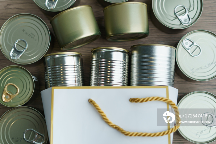 Canned food in shopping bag with group of Aluminium canned food.