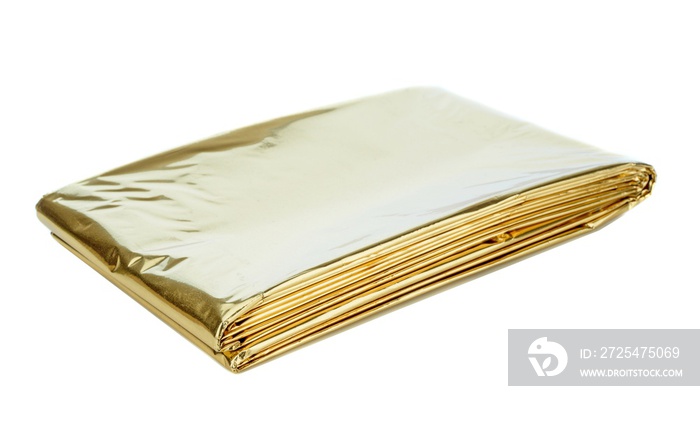 A golden aluminium foil emergency first aid kit heat sheet on a white background