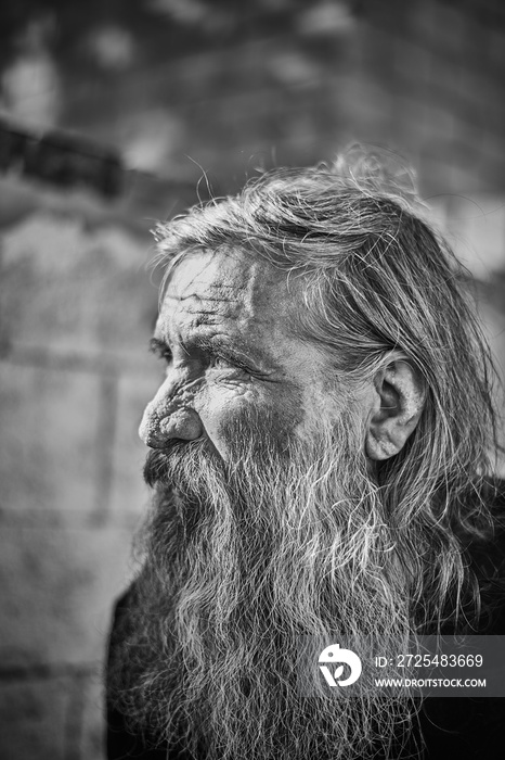 Close-up shot of an old homeless mans face