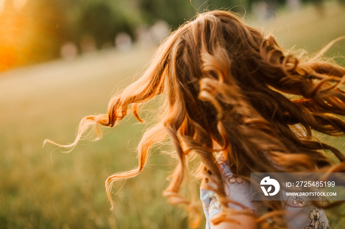 girl runs hair curls develop glow sun