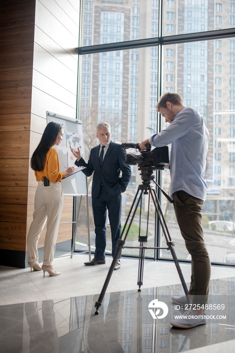 Journalists making a new program in the studio