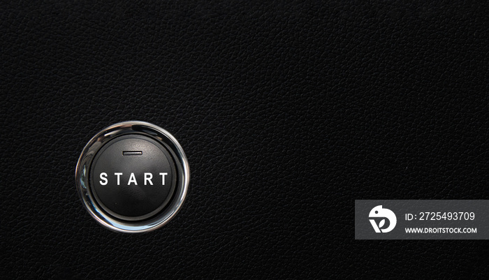 现代汽车中的启动按钮，黑色纹理表面上的按钮