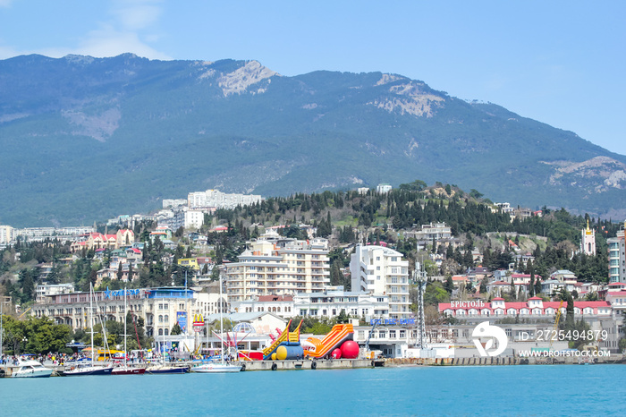 The city of Yalta and the panorama of the Crimean mountains, from the top of the hill.