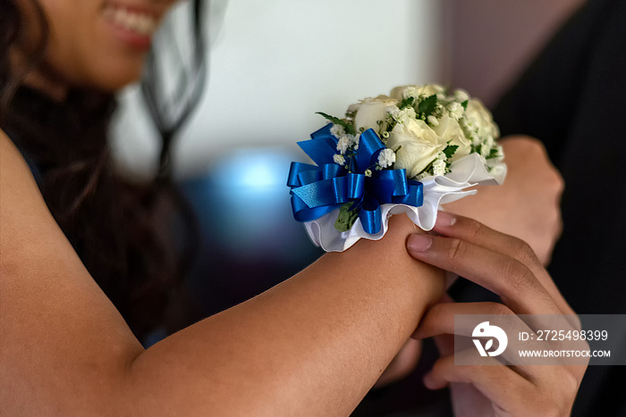 Corsage on female wrist - high school prom date