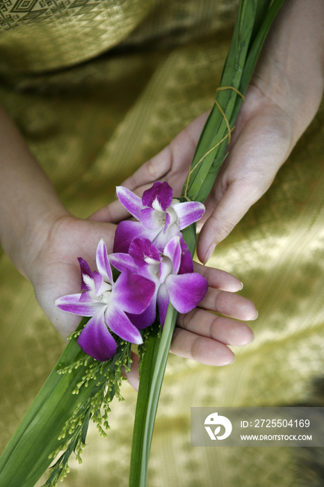 Thai woman with orchids, close up