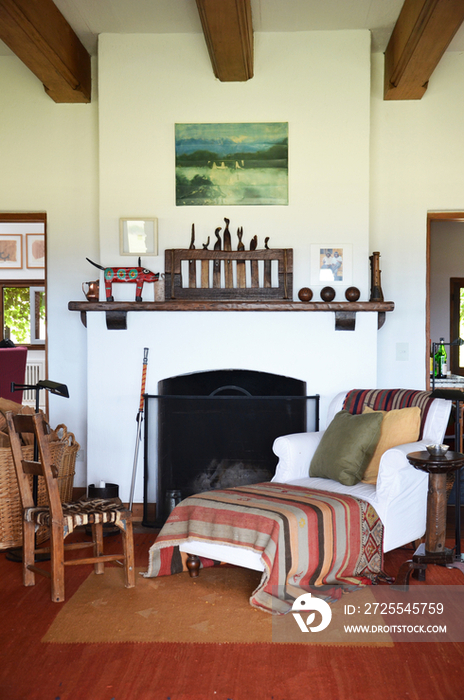 Armchair by fire place in house