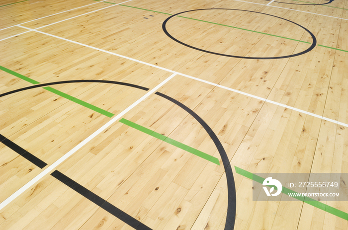 Close up of lines painted on the floor of the gymnasium hall of a modern secondary school