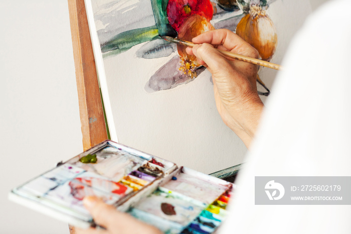 Cropped image of woman painting at studio