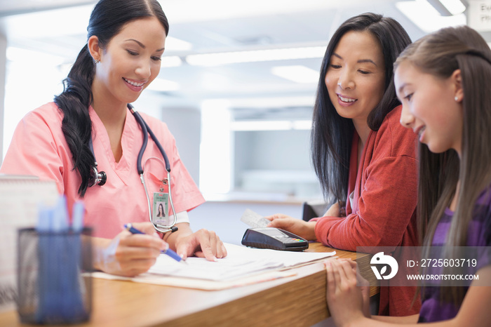 nurse reviewing costs with patient