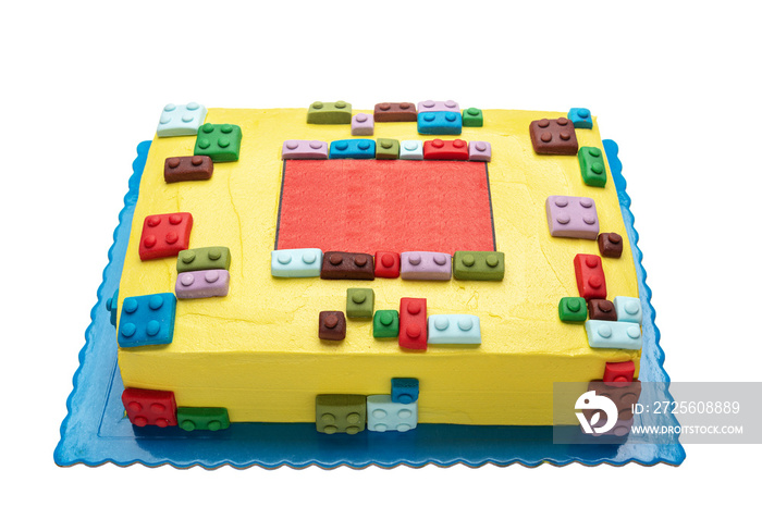 Cake from parts childrens designer lego. On a white background for a birthday.