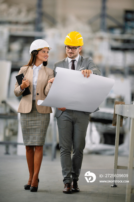 Architects working on construction project. Man and woman discussing work.