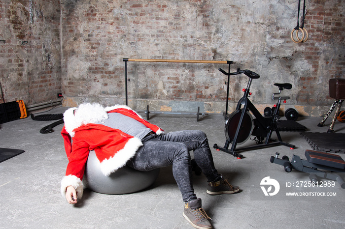 Fitness. Funny Santa Claus and gym.