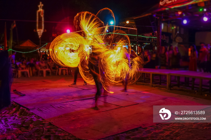 view of fantastic fire moving show on the beach, full moon party night life in Phi Phi islands, Krab