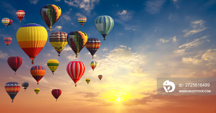 Hot air balloons on blue sky and cloud multi-color background.