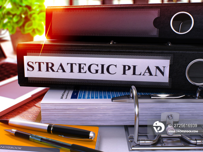 Strategic Plan - Black Ring Binder on Office Desktop with Office Supplies and Modern Laptop. Strateg