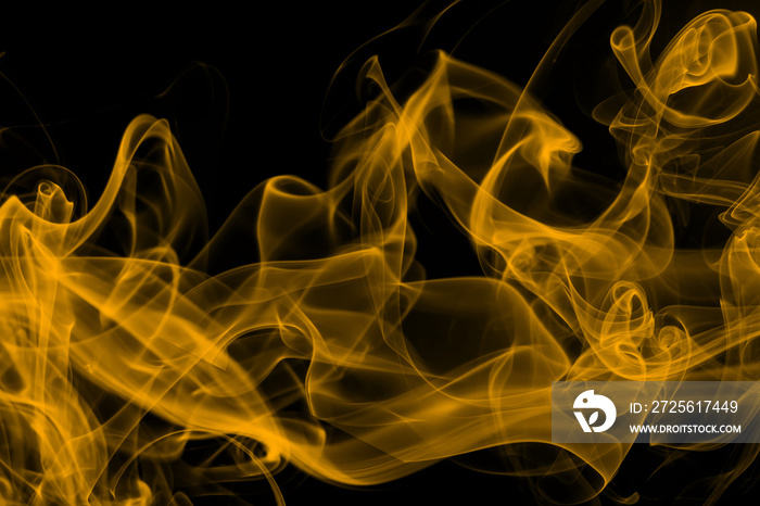 Beautiful movement yellow smoke abstract on black background, fire design