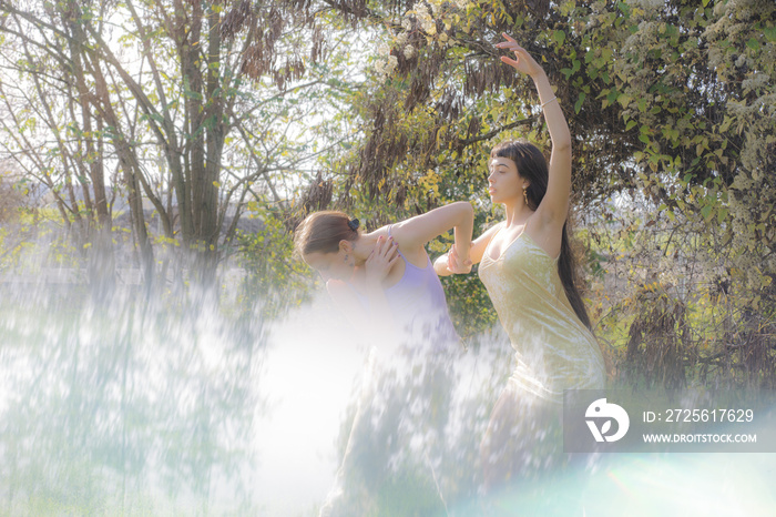 women in nature dancing