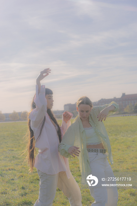 women in nature dancing