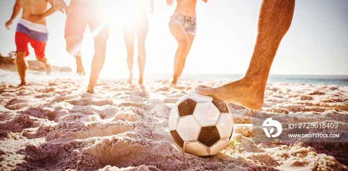 Friends playing football