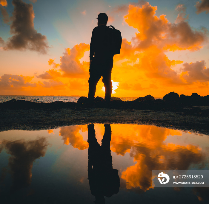 silhouette of a man on sunset photographer sky sun sunset reflection