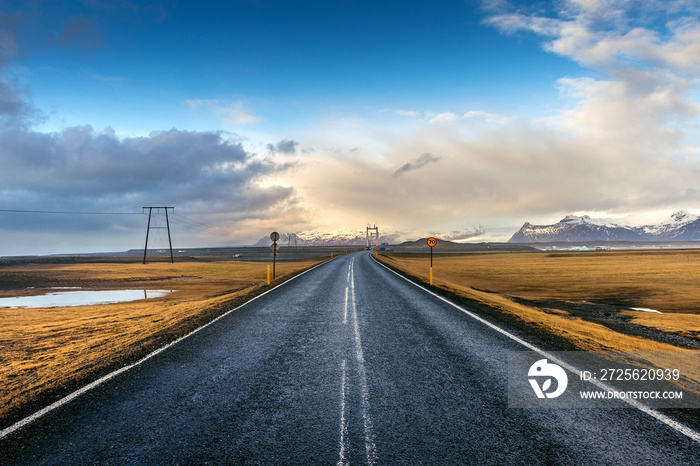 A long straight road and blue sky, Iceland.