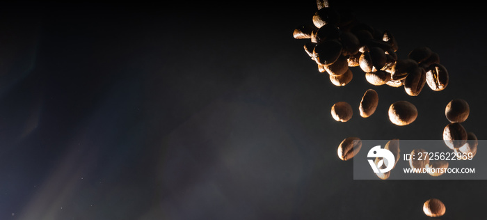 many flying coffee beans on black background