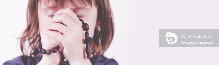 Religious education of child. Little cute child girl praying.