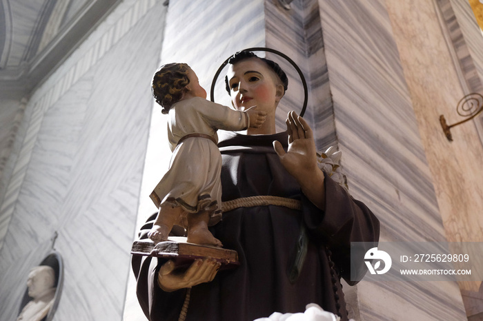 Saint Anthony of Padua holding baby Jesus statue in Basilica dei Santi Ambrogio e Carlo al Corso, Ro