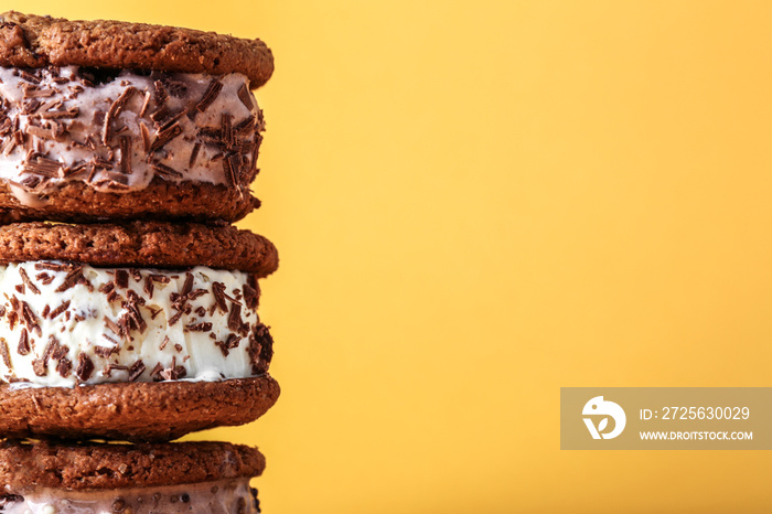 Ice cream cookie sandwiches on yellow background, closeup