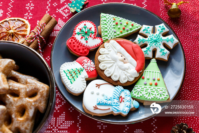 Gray plate with gingerbreads on the table. Holiday, celebration, cooking concept. Close up.  New Yea