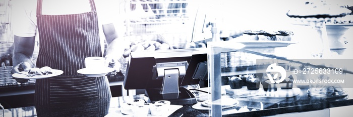 Smiling worker prepares breakfast