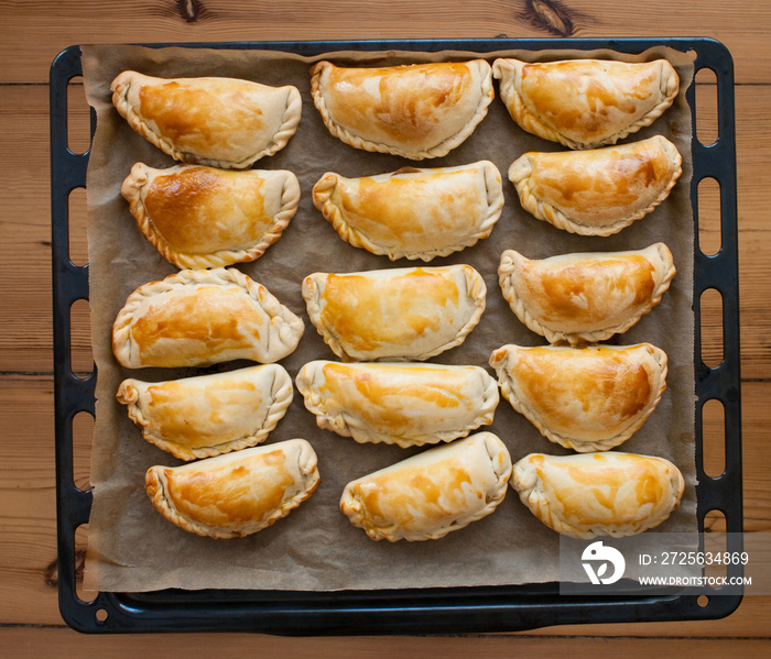 fresh empanadas - traditional food  on baking tray