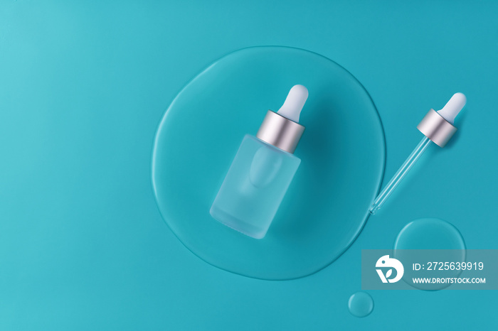 Cosmetics or skincare product ads with bottle and blue background, top view.