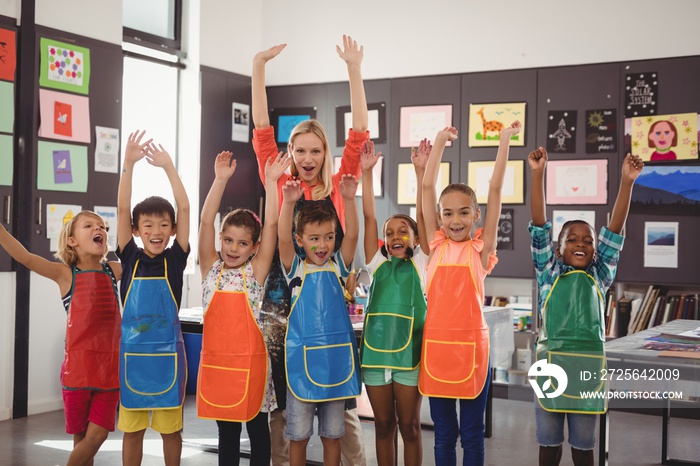 Portrait of teacher and schoolkids having fun