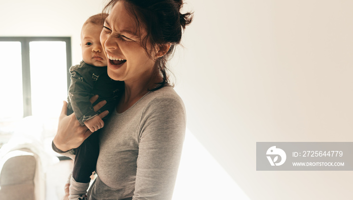 Portrait of a woman with her baby