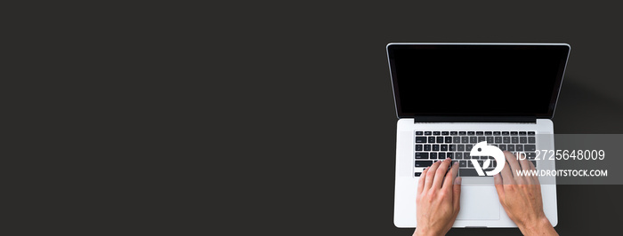 Person using a laptop computer from above