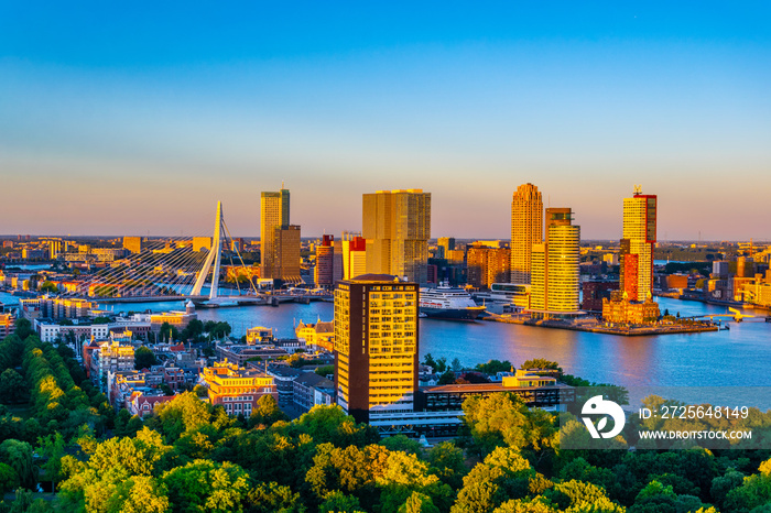 Sunset aerial view of Erasmus bridge and skyline of Rotterdam, Netherlands