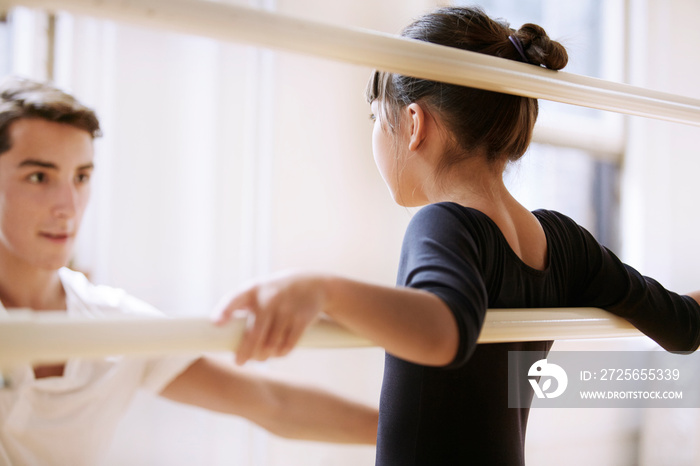 Girl listening to ballet teacher