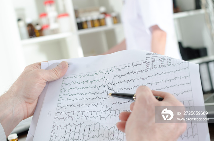 Doctor analyzing an electrocardiogram