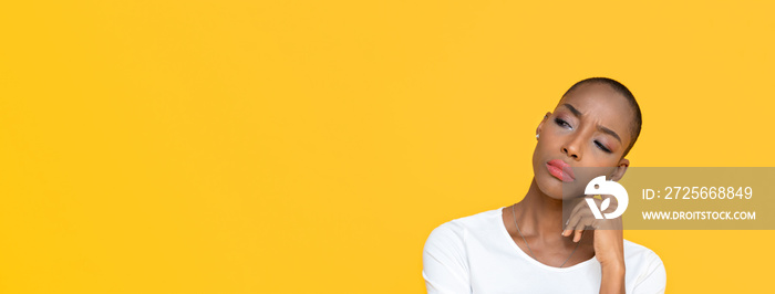 African American woman feeling bored on yellow isolated studio banner background with copy space