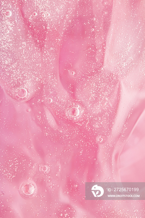 Abstract pink liquid background, paint splash, swirl pattern and water drops, beauty gel and cosmeti