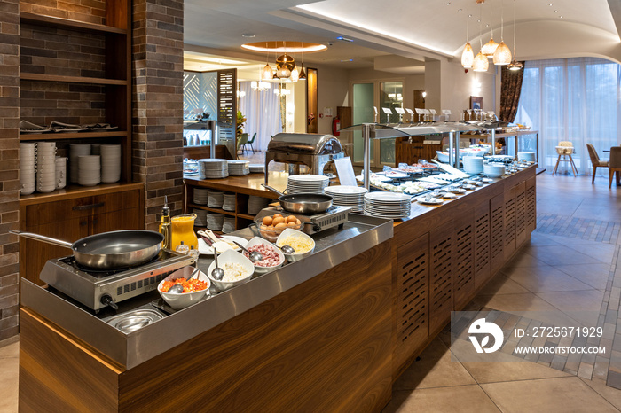 Breakfast served on a buffet table in a hotel restaurant